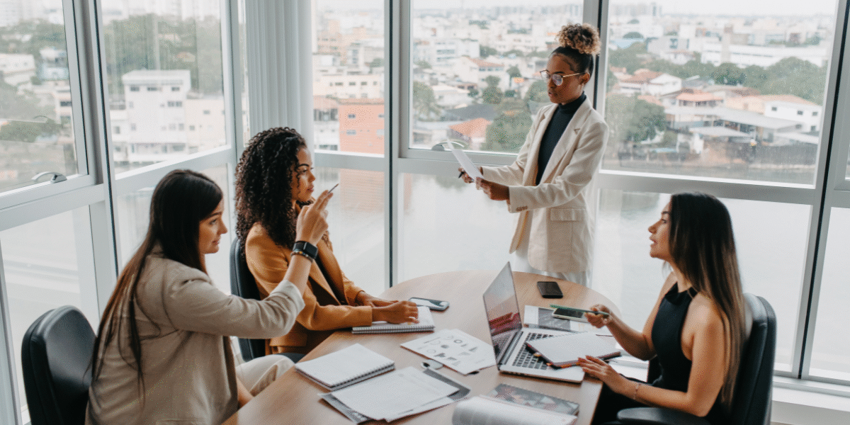Woman sitting thoughtfully while engaging with Change Leadership concepts in a calm workspace.